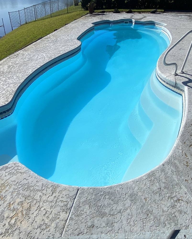 The same pool, clear and blue after green-to-clean recovery