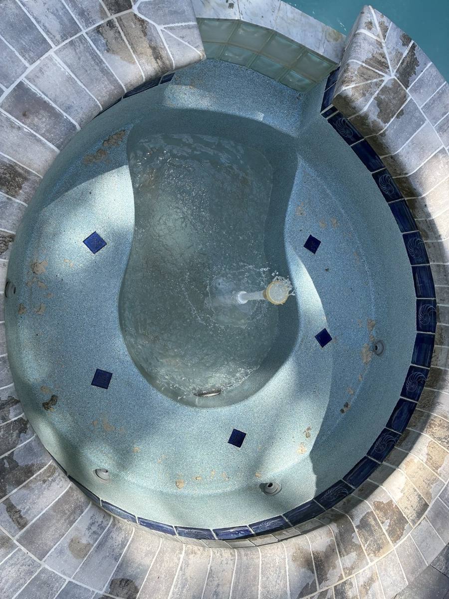 Empty tiled spa seen from above